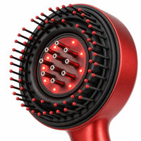 Close-up of LumiScalp brush head with red LED lights